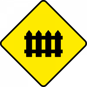 Level crossing ahead, guarded by gates or lifting barrier