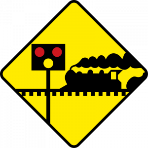 Level crossing ahead with lights and barriers