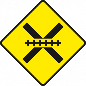 Level crossing ahead, unguarded by gates or lifting barrier