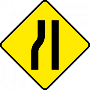 Road narrows from left